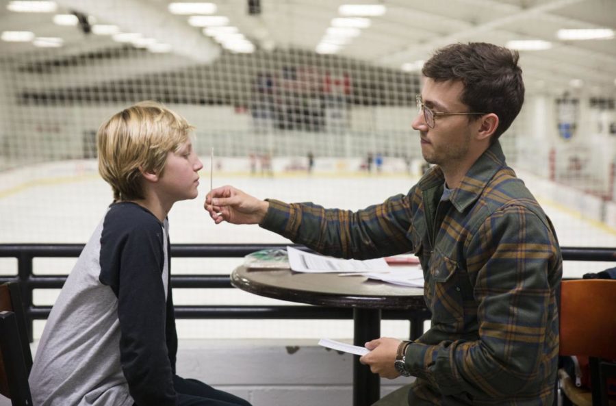  Jack Conroy, 12, performs the Vestibular Ocular Motor Screen (VOMS) test